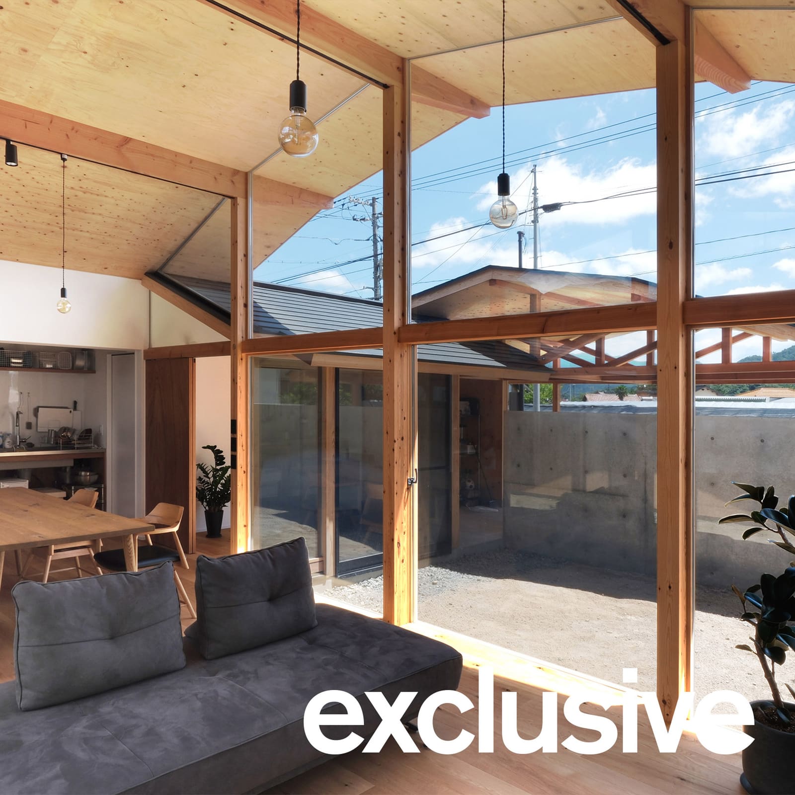 Dual-Angle Roof Shapes a Timber House That Reads the Land