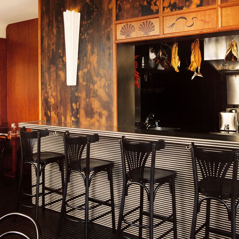 Patinated Timber and Marquetry Transform Parisian Eatery Into Contemporary Iberian Refuge