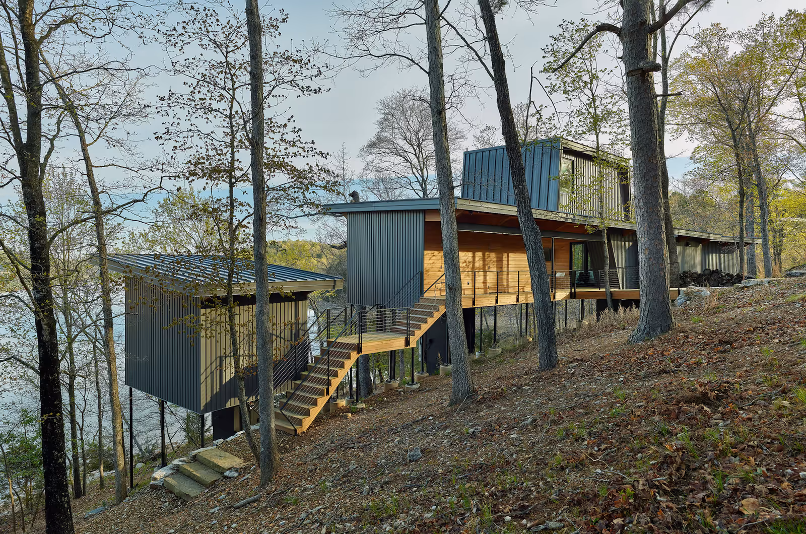 Modus Studio’s Grist Mill Cabin Blends Deconstructed Lakehouse Design With The Natural Hillside Of Beaver Lake