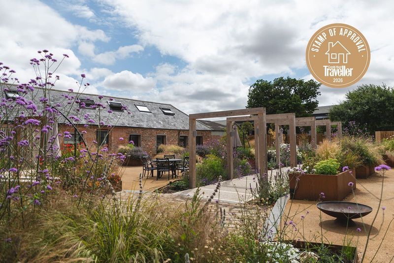 A Working Farm in Wiltshire Invites Families to Feed Lambs and Sleep in Converted Stables